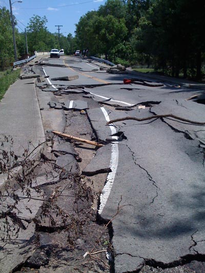 Buckled asphalt on Tucker Rd. off W. Hamilton Rd.